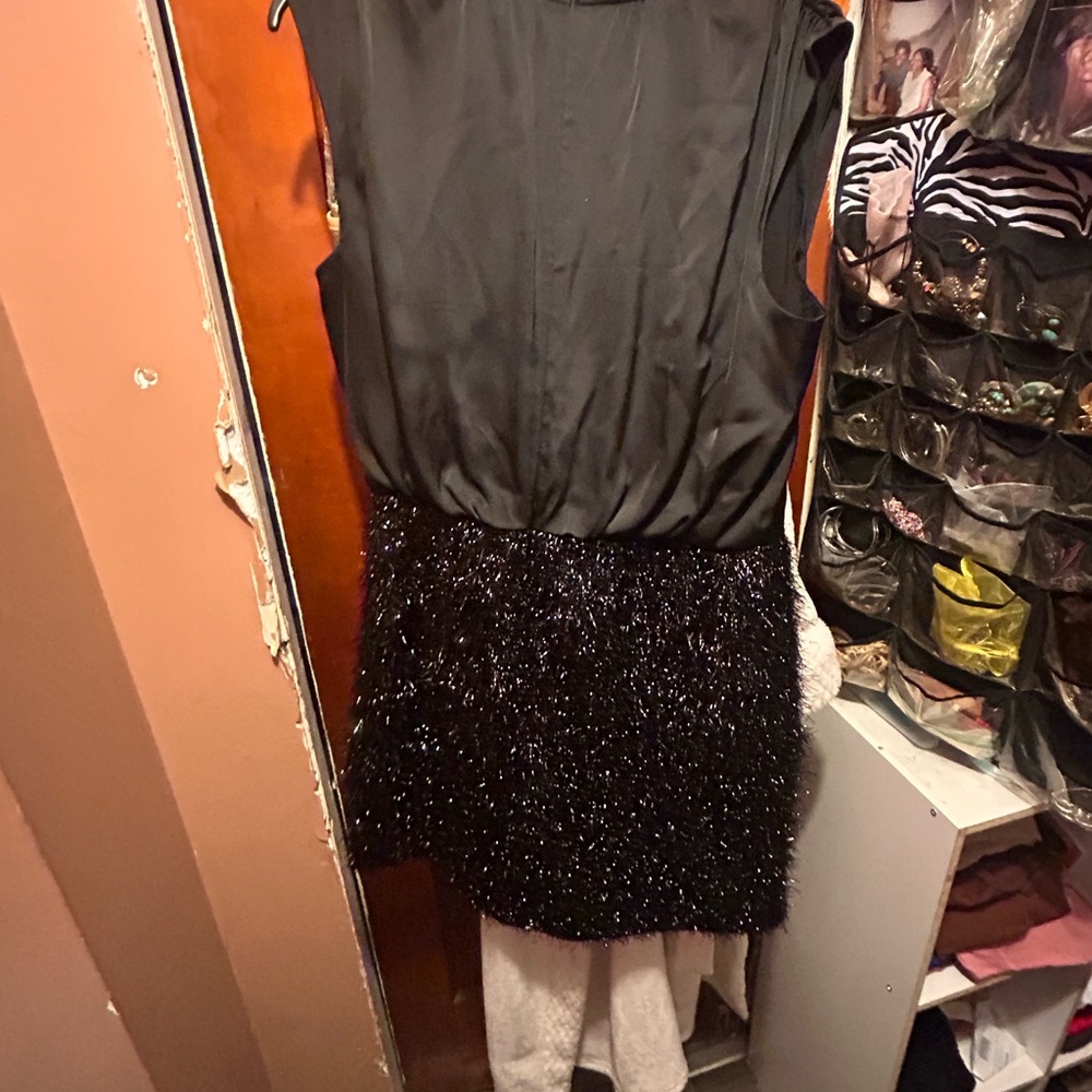 Chic Black Sleeveless Dress with Sequin Skirt